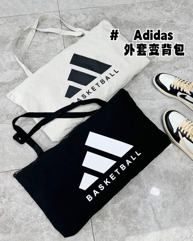 Adidas 阿迪达斯大口袋一衣多变连帽外套 颜色 黑色，灰白 尺码 M-3Xl 一衣多变，可当外套穿，可做背包 经典帅气 简约干练的设计 运动休闲皆宜的百搭款